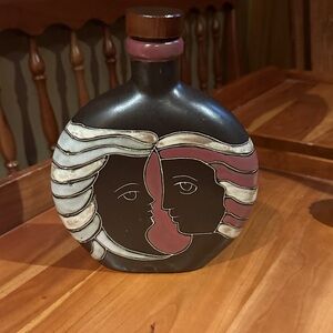 Artistic Ceramic Bottle with Face Design